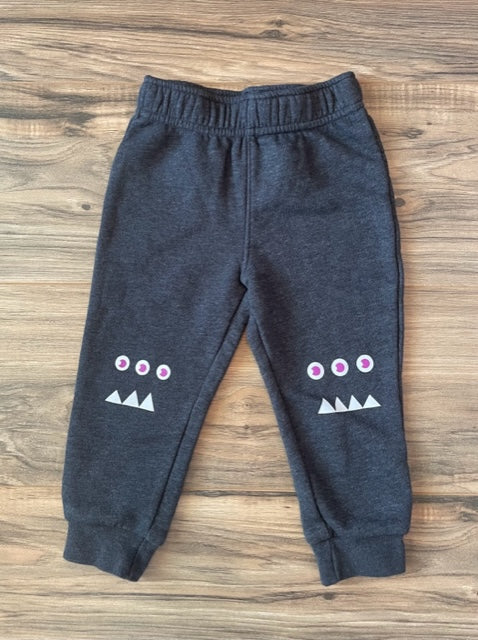 2T Cat & Jack joggers with monsters on knees
