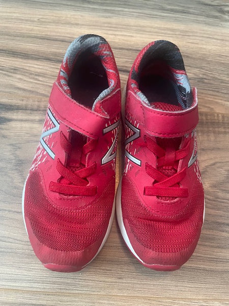 Size 12 New Balance red sneakers with elastic laces and velcro tabs
